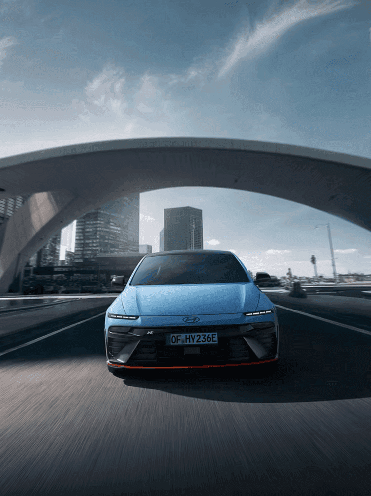 DVN--DVN--DVN--Hyundai_IONIQ-6N_Exterior-Front_Driving_CE_N_Exterior_Main_02_Urban_3x4.png
