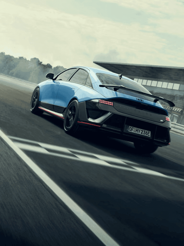 DVN--DVN--DVN--Hyundai_IONIQ-6N_Exterior-Rear-Quarter_Driving_22_IONIQ-6N_Driving-Rear_3x4.png